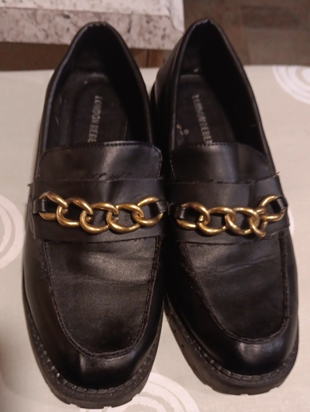 Black Leather Loafers with Gold Chain Accent